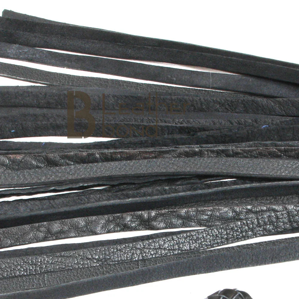 Close-up of thick leather falls on a BDSM flogger, designed for deep flogger spanking and heavy impact during flogger sex play