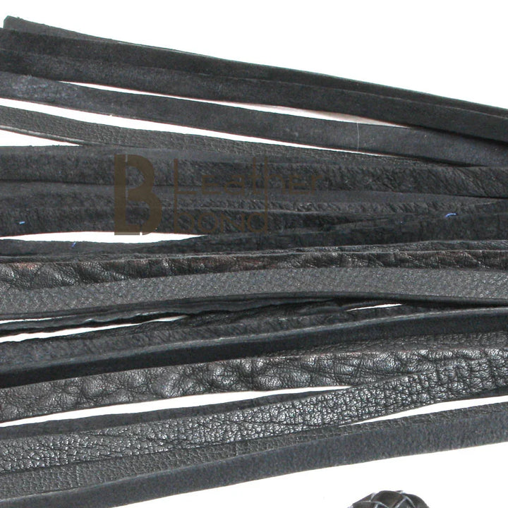 Close-up of thick leather falls on a BDSM flogger, designed for deep flogger spanking and heavy impact during flogger sex play