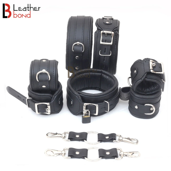 Complete black leather bondage cuffs set with two connectors – a piece of BDSM gear used as a sex toy for adult bondage play.