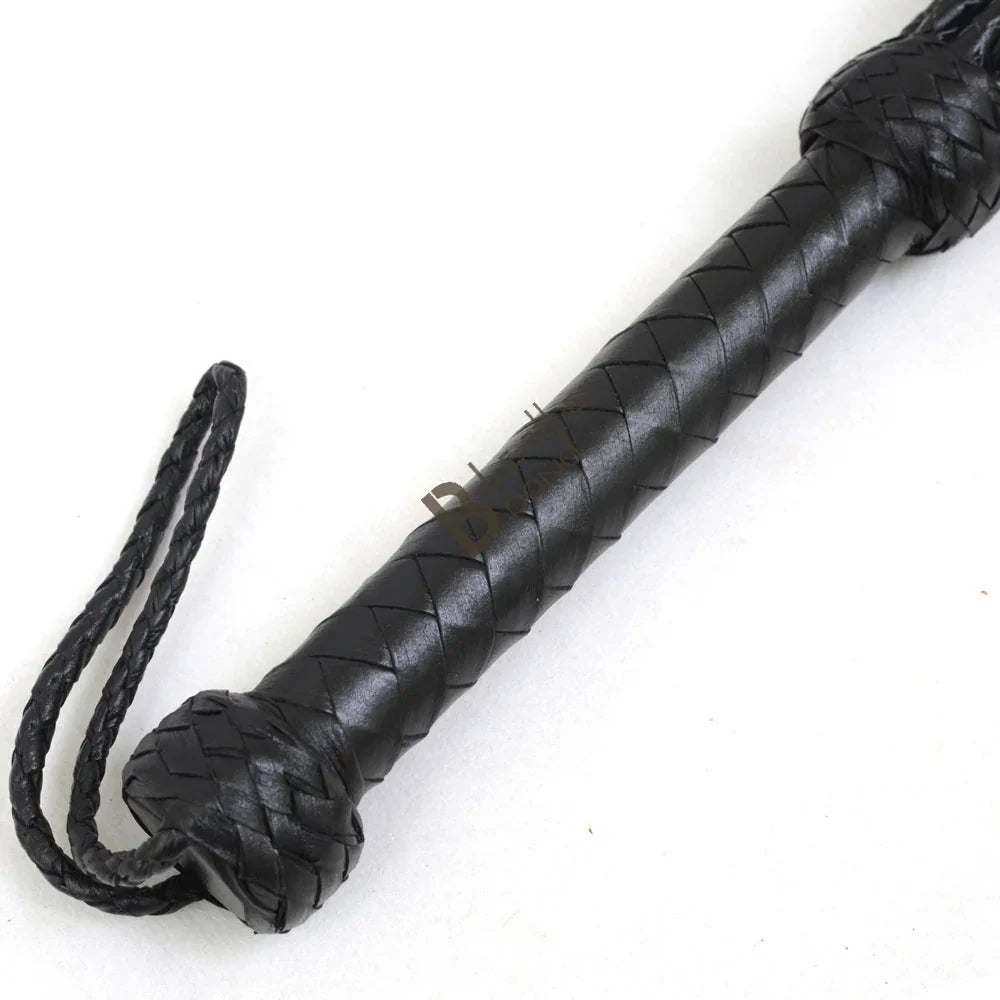 Braided leather handle and wrist loop of Cat-o-Nine BDSM flogger whip, offering control and balance for flogger sex and flogger spanking