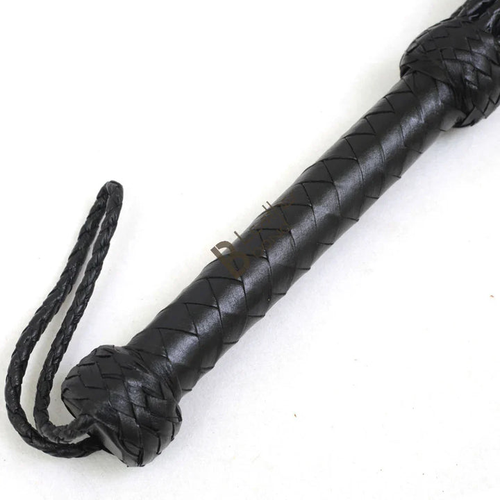 Braided leather handle and wrist loop of Cat-o-Nine BDSM flogger whip, offering control and balance for flogger sex and flogger spanking
