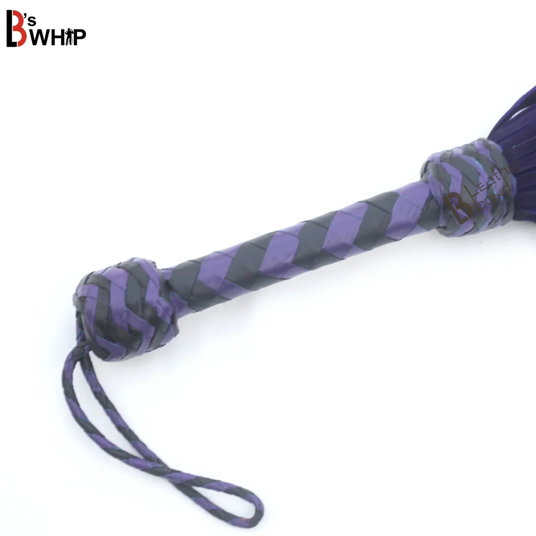 Braided leather handle and wrist loop on purple and black BDSM flogger whip, handcrafted for balance during flogger spanking and flogger sex.