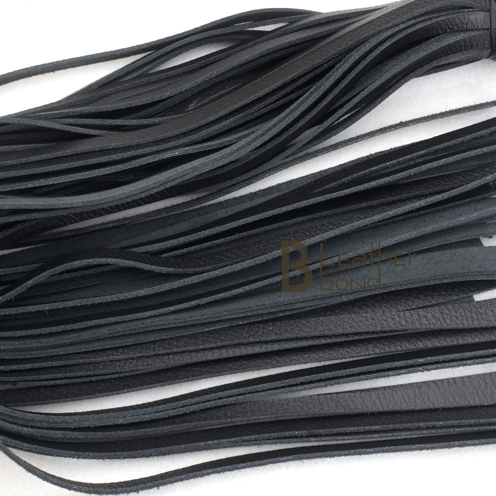 Close-up of 25 real leather falls on a heavy-duty BDSM flogger, designed for deep impact flogger spanking and high-intensity flogger sex play.