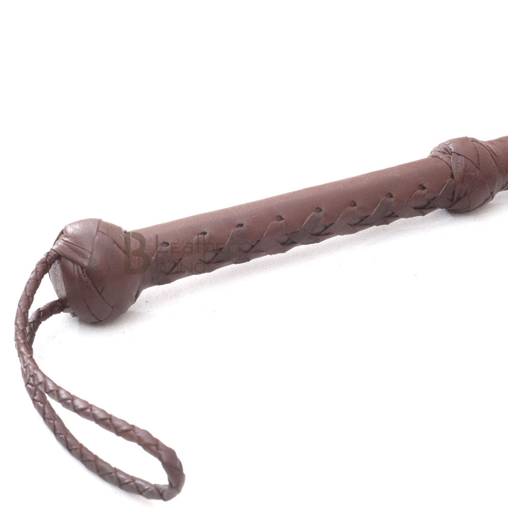 Close-up of 10ft dark brown bullwhip handle – LB Whip handmade cowhide leather with Turks head knot and wrist loop.