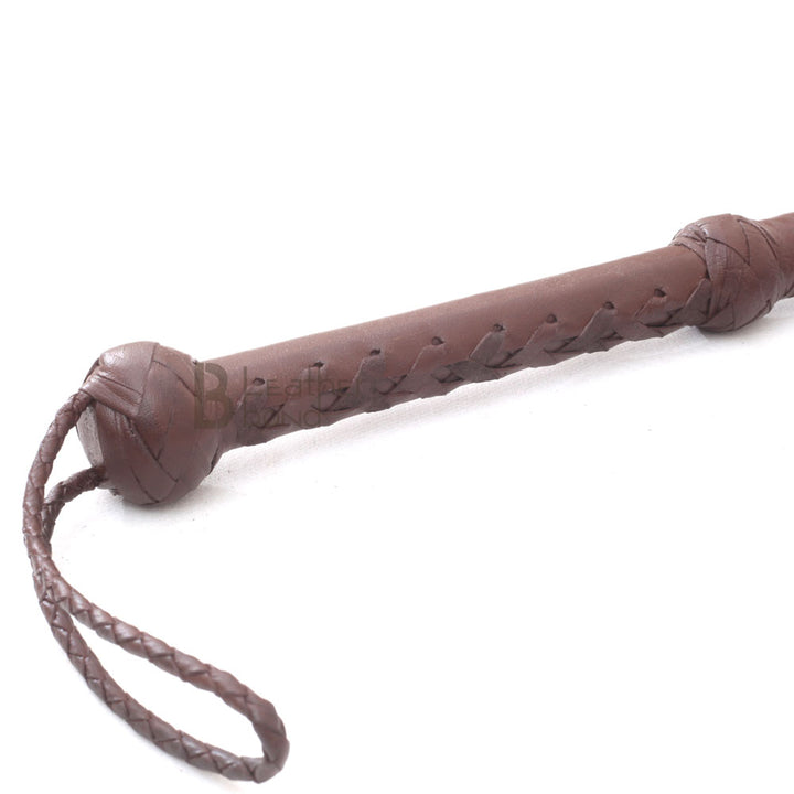 Close-up of 10ft dark brown bullwhip handle – LB Whip handmade cowhide leather with Turks head knot and wrist loop.