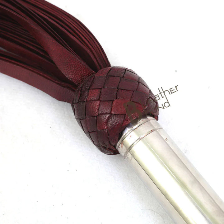 transition knot and steel handle on this handcrafted leather flogger, perfect for secure grip during BDSM flogger use